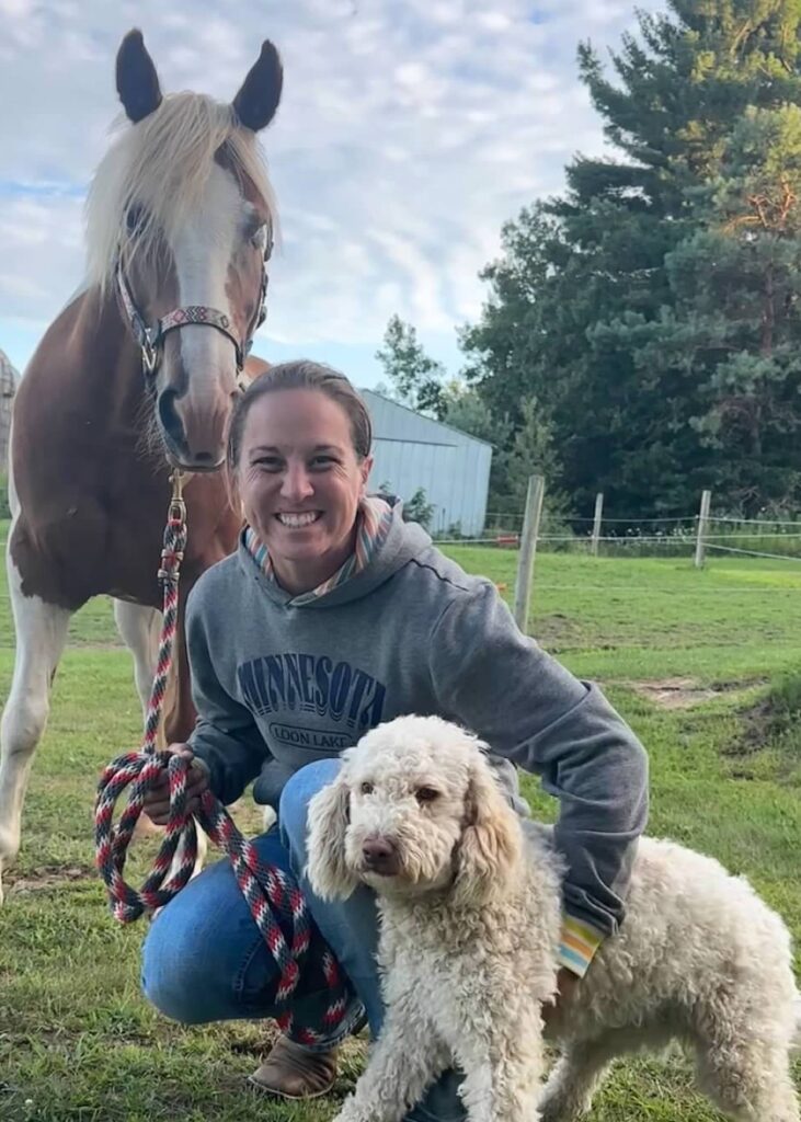 female with dog and horse